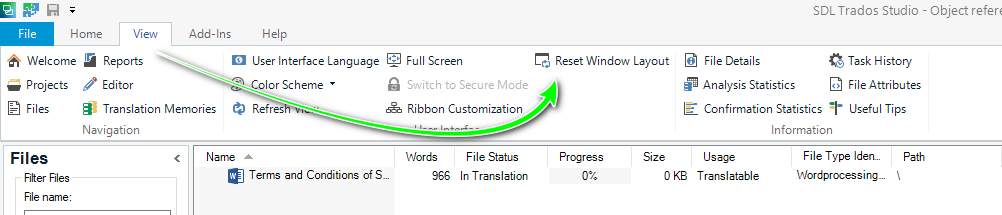 Screenshot of SDL Trados Studio interface highlighting the 'Reset Window Layout' option in the 'View' tab with a green arrow pointing to it.
