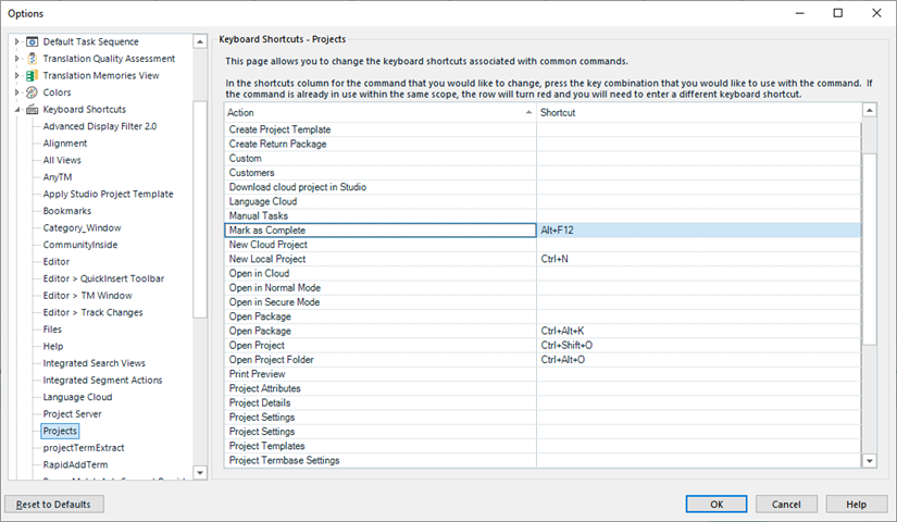Trados Studio Options dialog box showing Keyboard Shortcuts tab with a list of actions and their corresponding keyboard shortcuts.