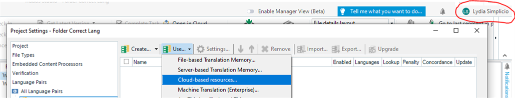 Trados Studio screenshot showing user Lydia Simplicio logged in at the top right corner and the dropdown menu for Cloud-based resources selected.