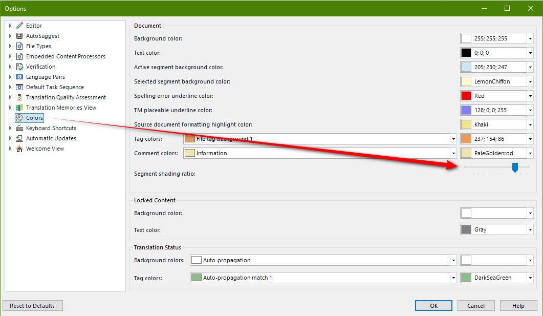 Trados Studio options window showing color settings with alternating white and grey background colors. A red arrow points to the 'Reset to Defaults' button.