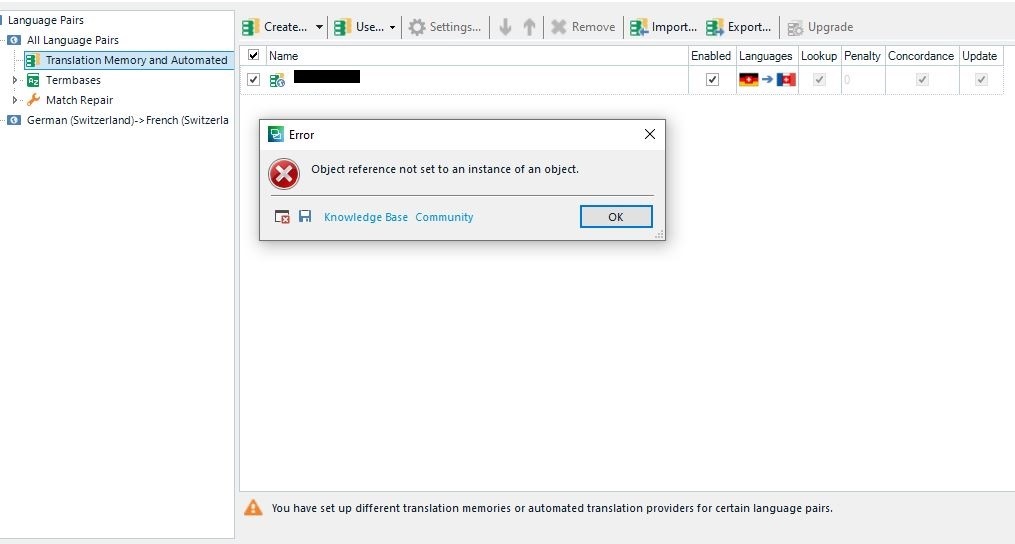 Trados Studio error message 'Object reference not set to an instance of an object' with a warning 'You have set up different translation memories or automated translation providers for certain language pairs'.