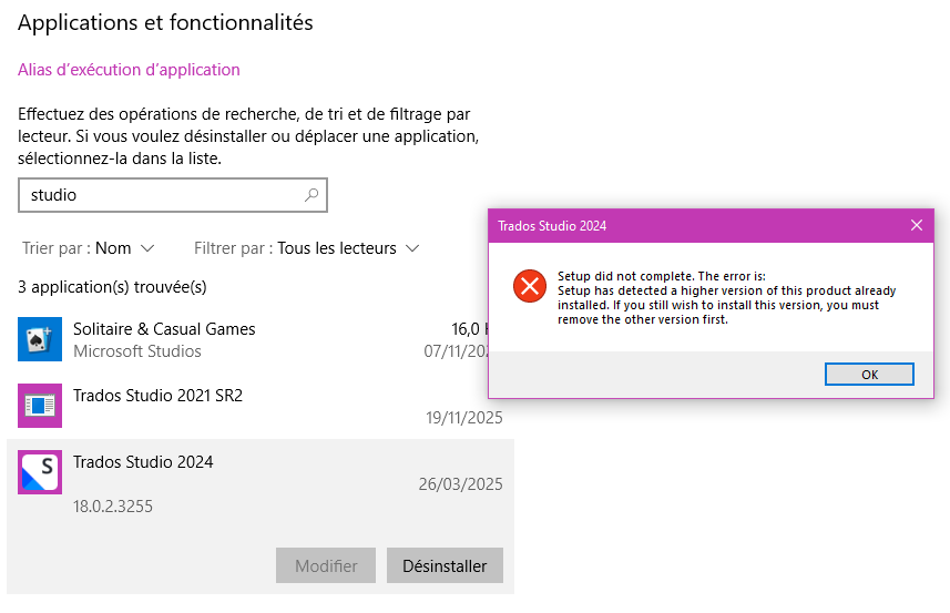 Windows settings showing a search for 'studio' with three applications listed: Solitaire & Casual Games, Trados Studio 2021 SR2, and Trados Studio 2024. A popup error message reads: 'Setup did not complete. The error is: Setup has detected a higher version of this product already installed. If you still wish to install this version, you must remove the other version first.'
