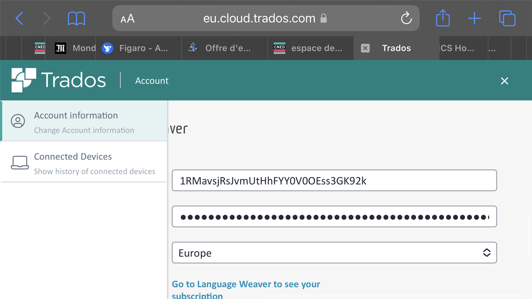 Desktop screenshot showing Trados account page with 'Account information' and 'Connected Devices' sections, and obscured login ID and secret key fields.