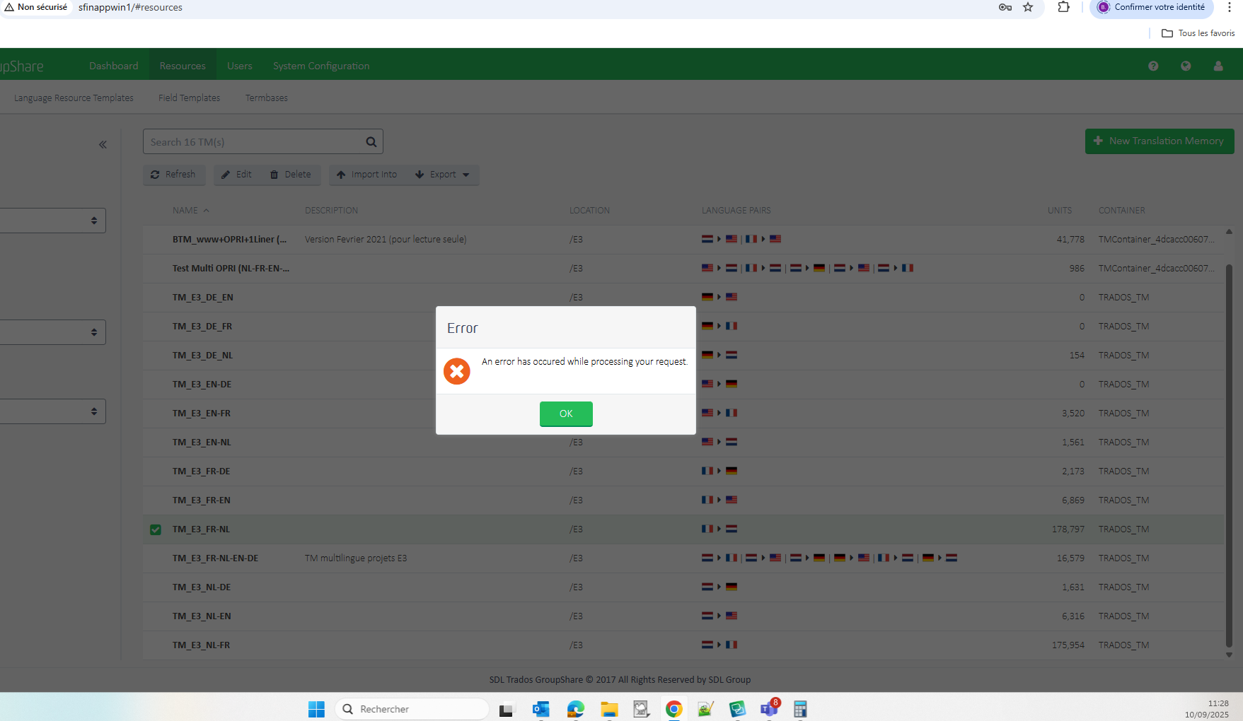 Trados GroupShare 2017 interface showing a list of translation memories with an error popup stating 'An error has occurred while processing your request' and an OK button.