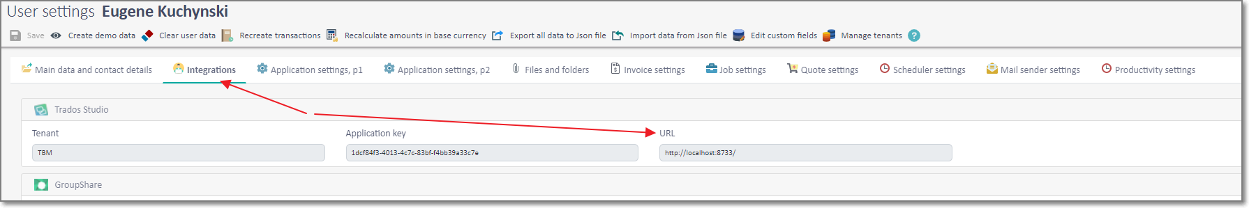 User settings page showing Integrations tab selected with Trados Studio highlighted. Two red arrows point to Application key and URL fields.