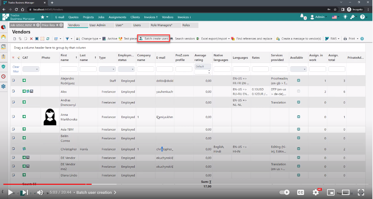 Trados Studio Vendors interface with 'Batch create users' button highlighted in red, showing a list of vendors with their details like name, employment status, and services provided.