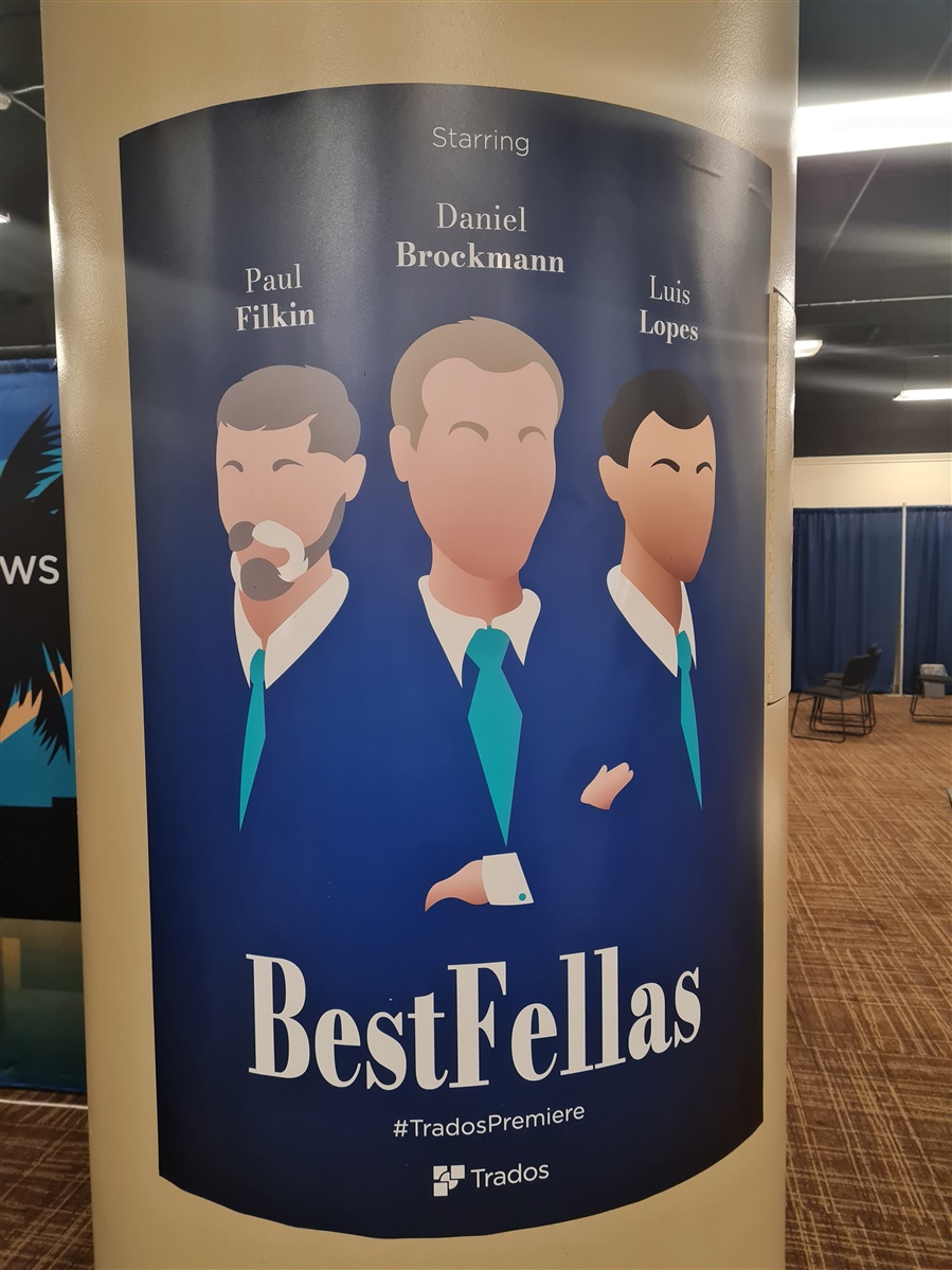 Promotional banner with the title 'Best Fellas' and hashtag 'TradosPremiere' at the bottom. Names 'Paul Filkin', 'Daniel Brockmann', and 'Luis Lopes' are listed as 'Starring'.