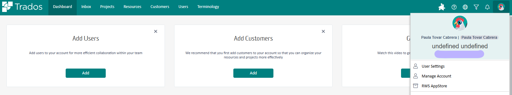 Trados Cloud interface with a profile dropdown menu open, showing the user's name 'Paula Tovar Cabrera' and placeholders 'undefined undefined' next to the profile picture.