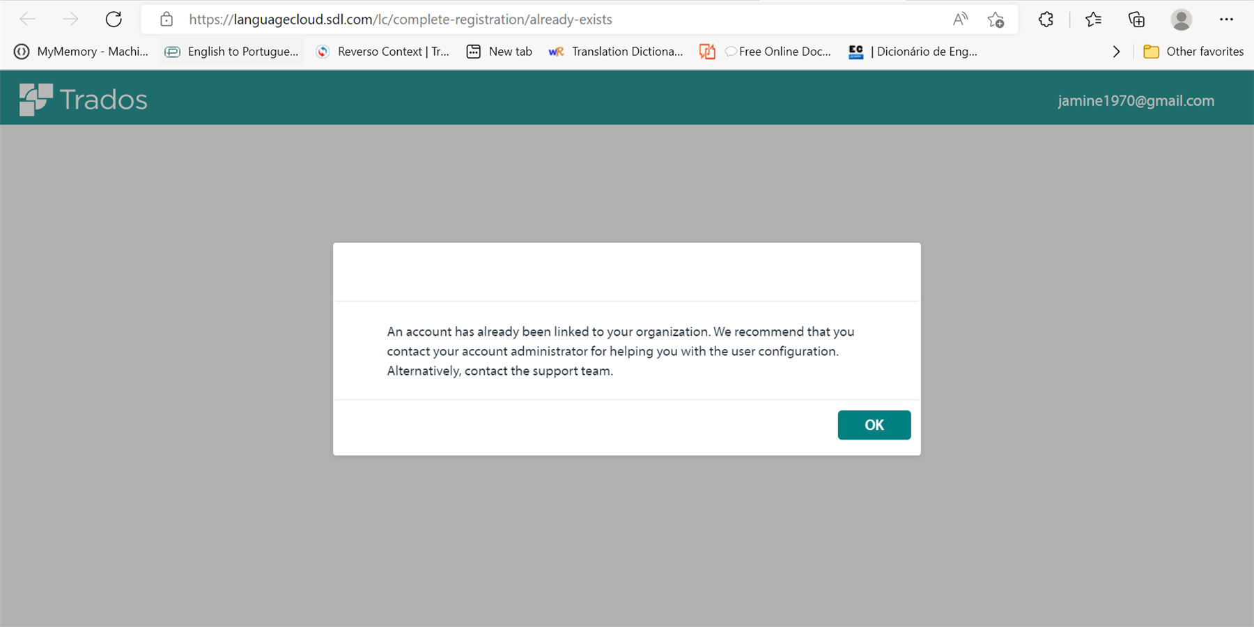 Web browser displaying Trados Language Cloud error message 'An account has already been linked to your organization' with a recommendation to contact the account administrator or support team.