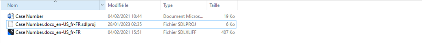 File explorer showing Trados Studio files with greyed out icons for sdlproj and sdlxliff file types.