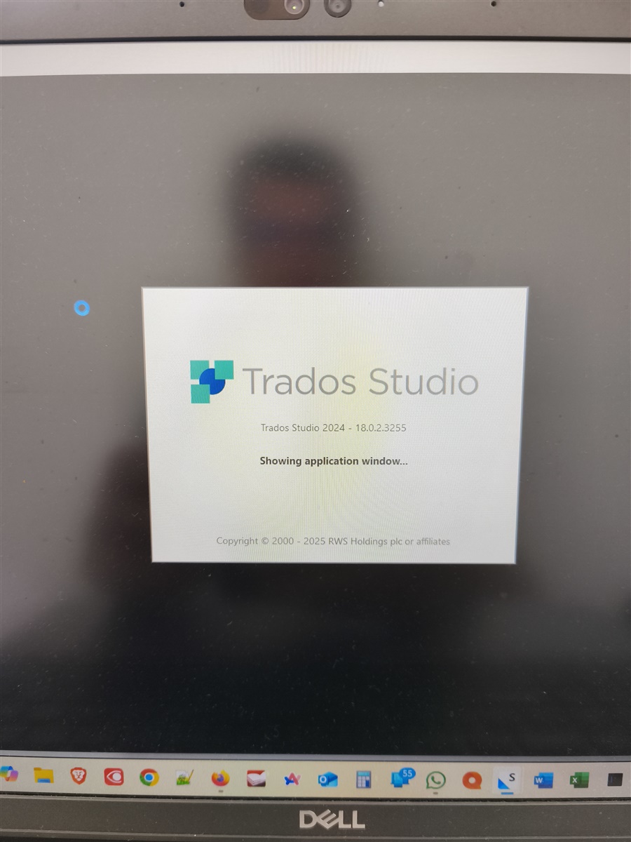 Trados Studio 2024 splash screen displaying version 18.0.2.3255 with the message 'Showing application window...' on a Dell laptop screen.