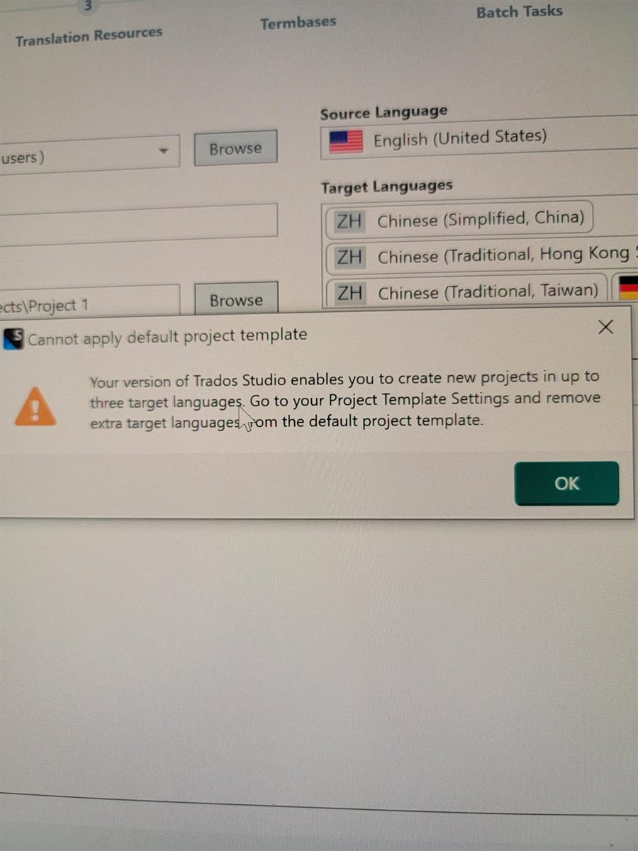Error message in Trados Studio stating 'Cannot apply default project template. Your version of Trados Studio enables you to create new projects in up to three target languages. Go to your Project Template Settings and remove extra target languages from the default project template.' with an OK button.
