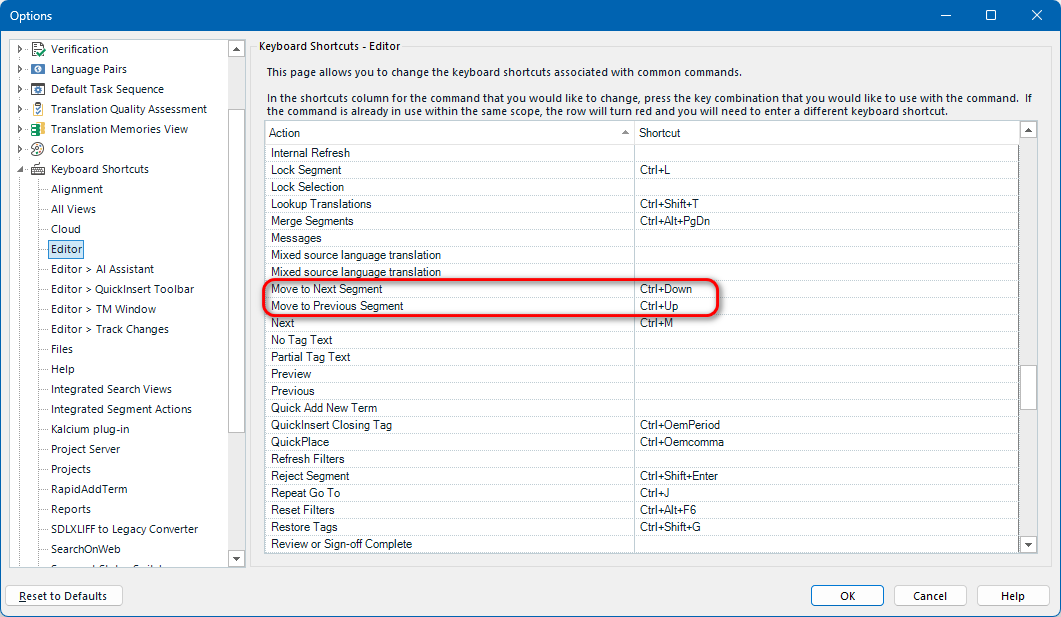 Trados Studio options window showing the Keyboard Shortcuts Editor. The shortcuts for 'Move to Next Segment' (Ctrl+Down) and 'Move to Previous Segment' (Ctrl+Up) are highlighted in red.