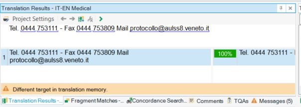 Screenshot of Trados Studio interface showing the Translation Results pane with a message 'Different target in translation memory.' The results are partially obscured by the project settings bar.