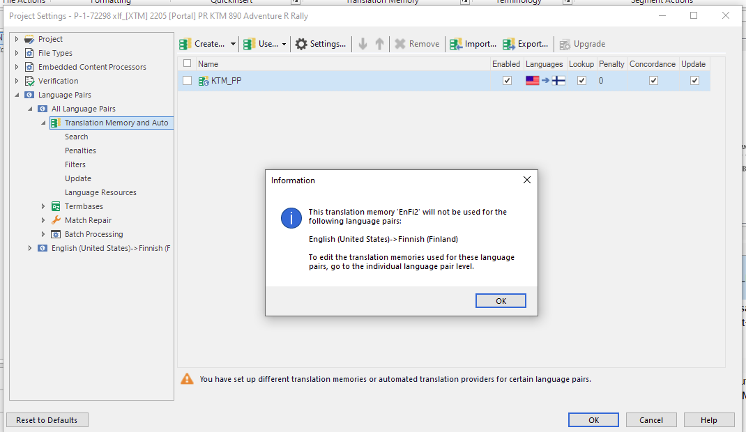 Trados Studio screenshot showing an 'Information' window with a message that the translation memory 'EnFi2' will not be used for English (United States) to Finnish (Finland) language pair and instructions to edit the translation memories at the individual language pair level.