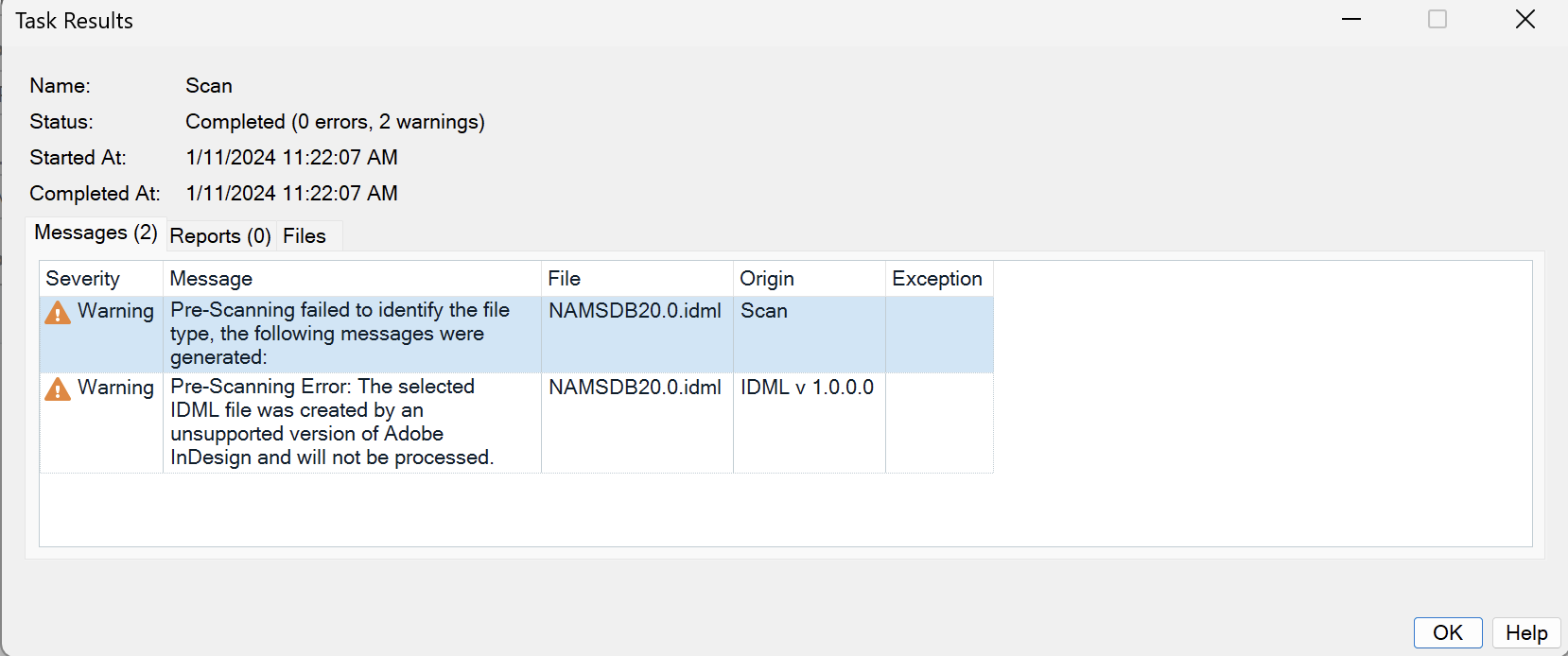 Trados Studio Task Results window showing two warnings related to pre-scanning failure and unsupported Adobe InDesign IDML file version.