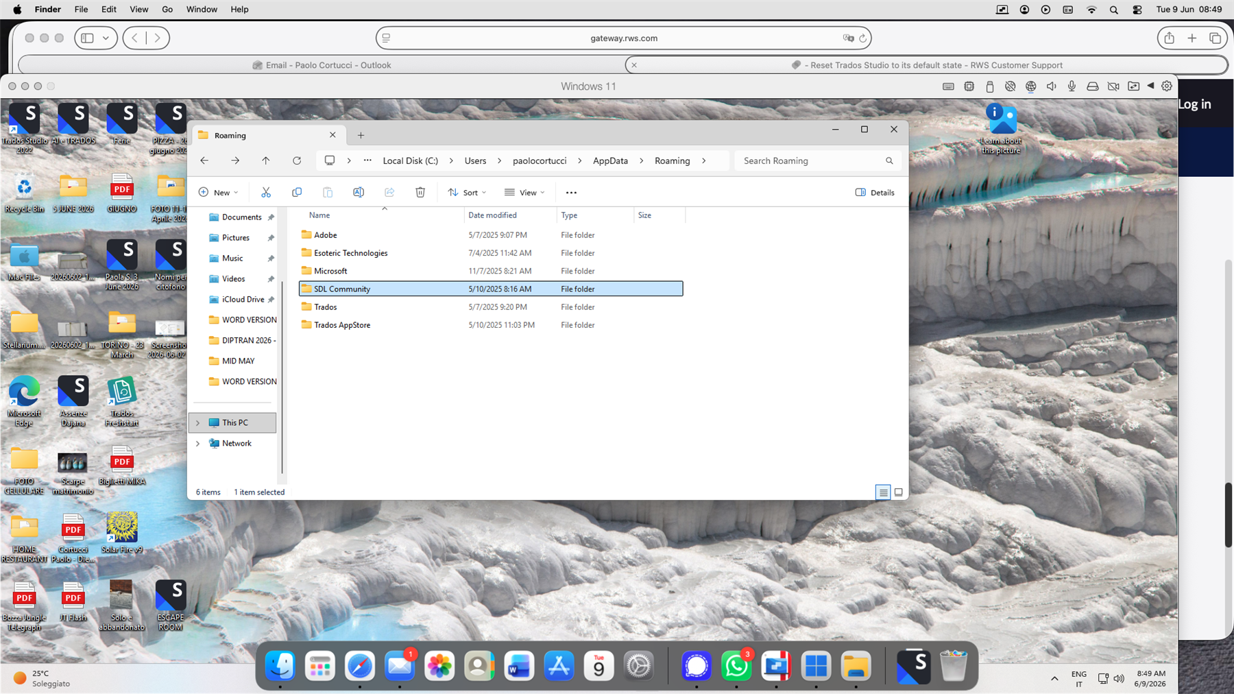 A screenshot showing a Windows 11 file explorer window open to the 'Roaming' folder, highlighting the 'SDL Community' folder. The desktop background displays a rocky landscape.