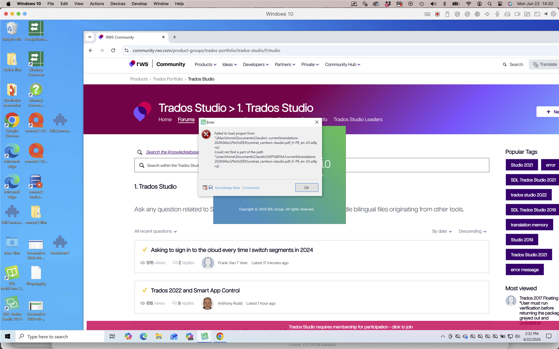 A Windows 10 desktop showing the RWS Community Trados Studio forum in a browser. An error message is displayed, stating 'Failed to load project' due to a missing file path.