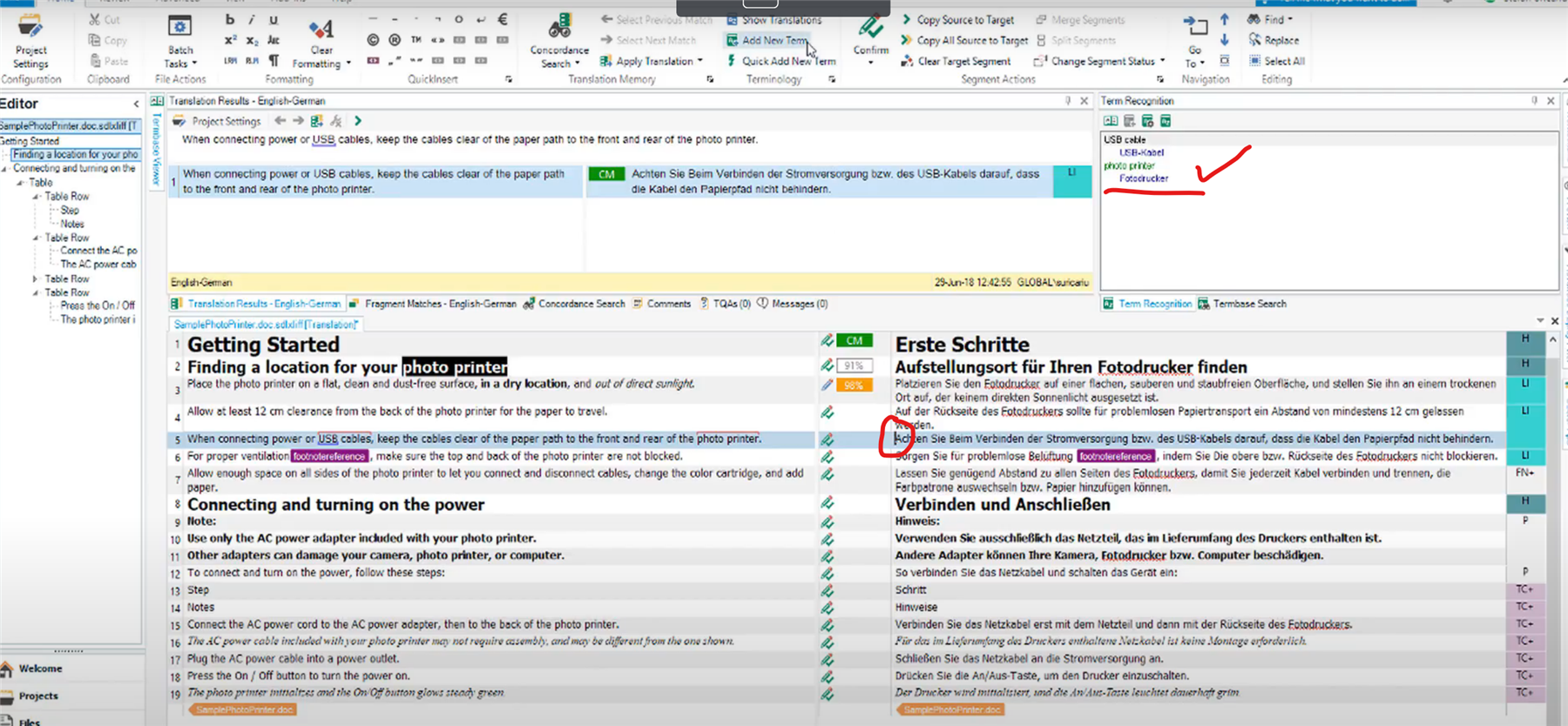 Trados Studio interface showing English-German translation with term recognition results for 'USB cable' and 'photo printer' displayed in the upper right corner.
