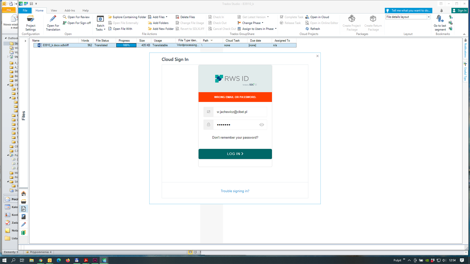 Trados Studio login screen with an error message 'WRONG EMAIL OR PASSWORD.' for the email w.jachewicz@cibet.pl.