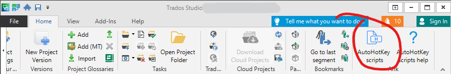 Trados Studio interface showing the Home tab with an 'AutoHotKey scripts' button highlighted in a red circle.