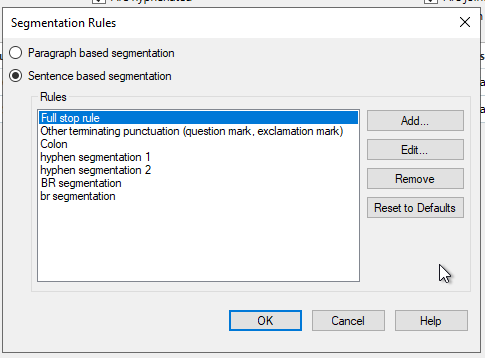 Screenshot of the Segmentation Rules window in Trados Studio displaying a list of rules including Full stop rule, Other terminating punctuation, Colon, hyphen segmentation 1, hyphen segmentation 2, BR segmentation, with an option to reset to defaults.