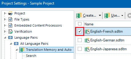 Trados Studio Project Settings window showing a checked checkbox next to English-French.sdlTM under Translation Memory and Auto Search.