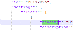 Screenshot of JSON code highlighting the 'heading' and 'description' elements within the settings of a slide.