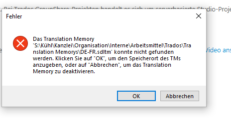 Error message in Trados Studio stating 'The Translation Memory 'S:KuhlkKanzleiOrganisationInterneArbeitsmittelTradosTranslation MemorysDE-FR.sdltm' could not be found. Click 'OK' to specify the location of the TM, or 'Cancel' to deactivate the Translation Memory.' with 'OK' and 'Cancel' buttons.