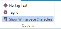 Dropdown menu in Trados Studio with options 'No Tag Text', 'Tag Id', and 'Show Whitespace Characters' under 'Options' heading.
