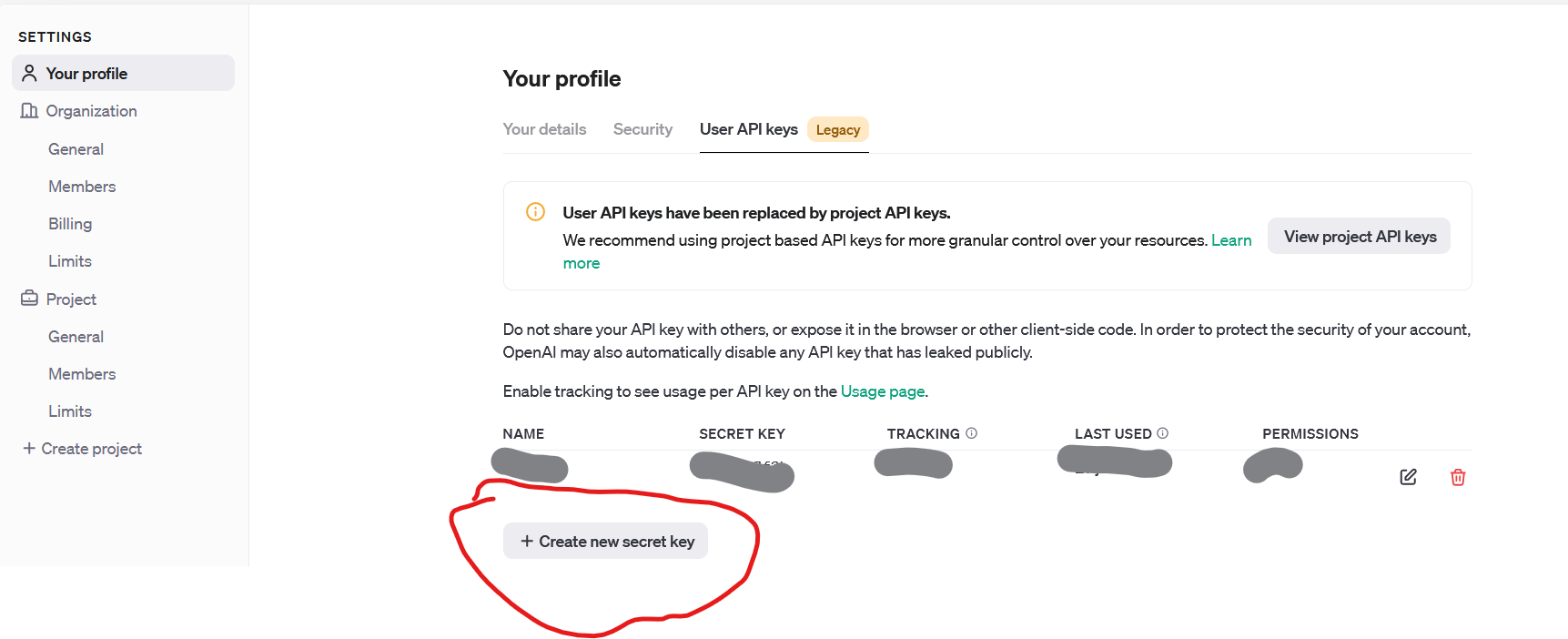 OpenAI platform 'Your profile' page with a warning message stating 'User API keys have been replaced by project API keys.' A red hand-drawn circle highlights the 'Create new secret key' button.