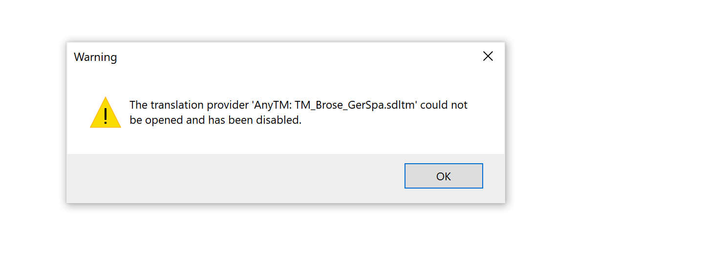 Warning dialog box stating 'The translation provider AnyTM: TM_Brose_GerSpa.sdltm could not be opened and has been disabled' with an OK button.