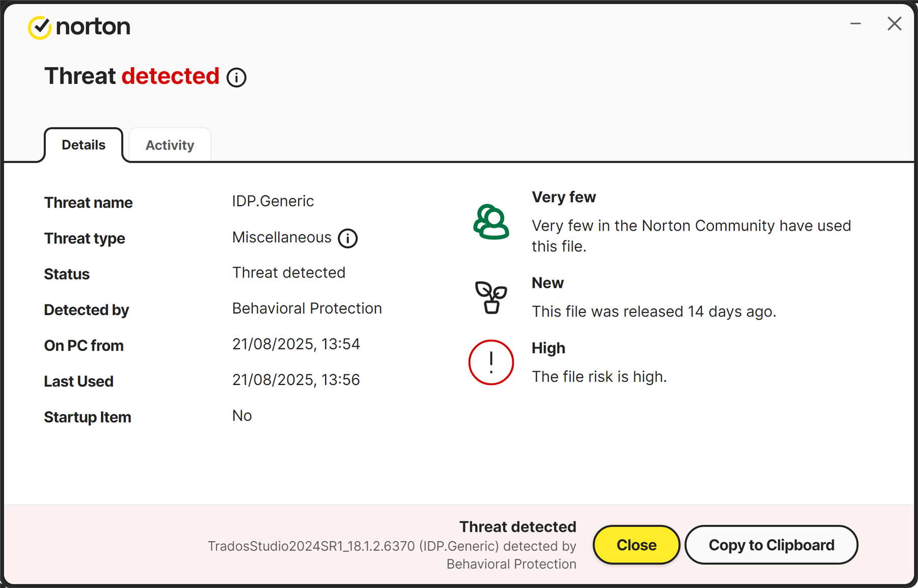 Norton security alert showing 'Threat detected' for TradosStudio2024SR1_18.1.2.6370, identified as IDP.Generic with high risk. File is new and rarely used in the Norton Community.