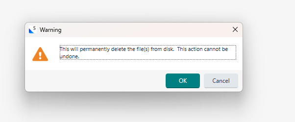 Warning dialog with a triangle icon, stating 'This will permanently delete the file(s) from disk. This action cannot be undone.' with OK and Cancel buttons.