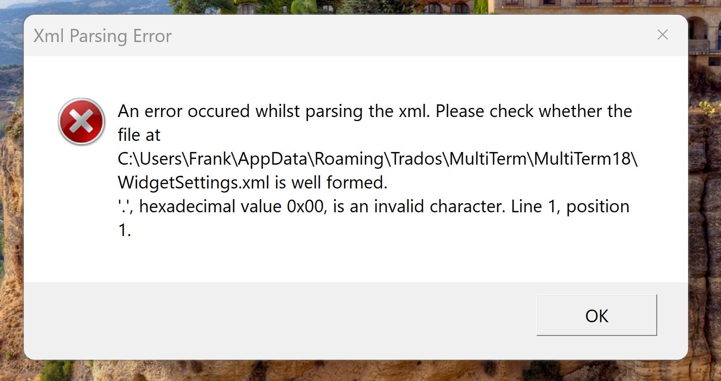Error dialog box titled 'Xml Parsing Error' with a message stating an error occurred while parsing the XML and to check if the file at 'C:UsersFrankAppDataRoamingTradosMultiTermMultiTerm18WidgetSettings.xml' is well formed. It mentions a hexadecimal value 0x00 as an invalid character at line 1, position 1.