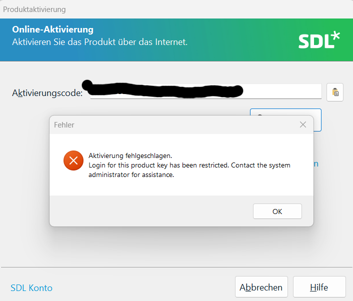 Trados Studio activation screen with an error message popup saying 'Activation failed. Login for this product key has been restricted. Contact the system administrator for assistance.'