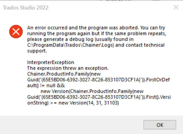 Error message in Trados Studio 2022 indicating 'An error occurred and the program was aborted.' It suggests generating a debug log and contacting technical support. Details include 'InterpreterException' and file paths.