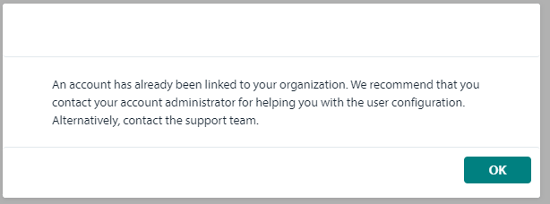 A pop-up message stating 'An account has already been linked to your organization. We recommend that you contact your account administrator for helping you with the user configuration. Alternatively, contact the support team.' with an 'OK' button.