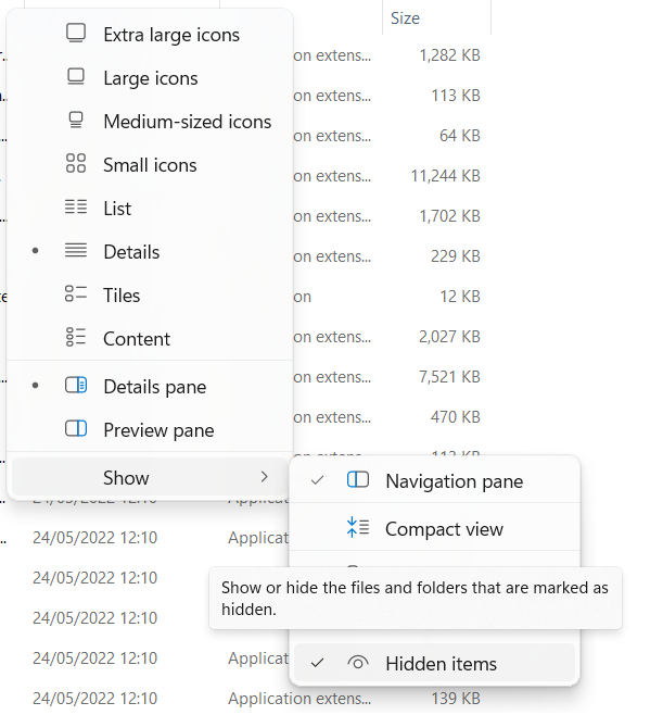Screenshot showing a file explorer menu with options like Extra large icons, Large icons, Medium-sized icons, Small icons, List, Details, Tiles, Content, Details pane, and Preview pane. The 'Show' submenu is expanded, displaying options such as Navigation pane, Compact view, and Hidden items. The Hidden items option is checked, with a tooltip saying 'Show or hide the files and folders that are marked as hidden.'