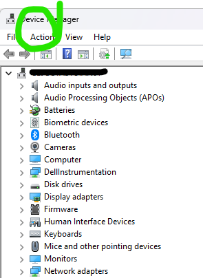 Screenshot of the Device Manager window showing a list of hardware categories, with the 'Action' menu highlighted in green.