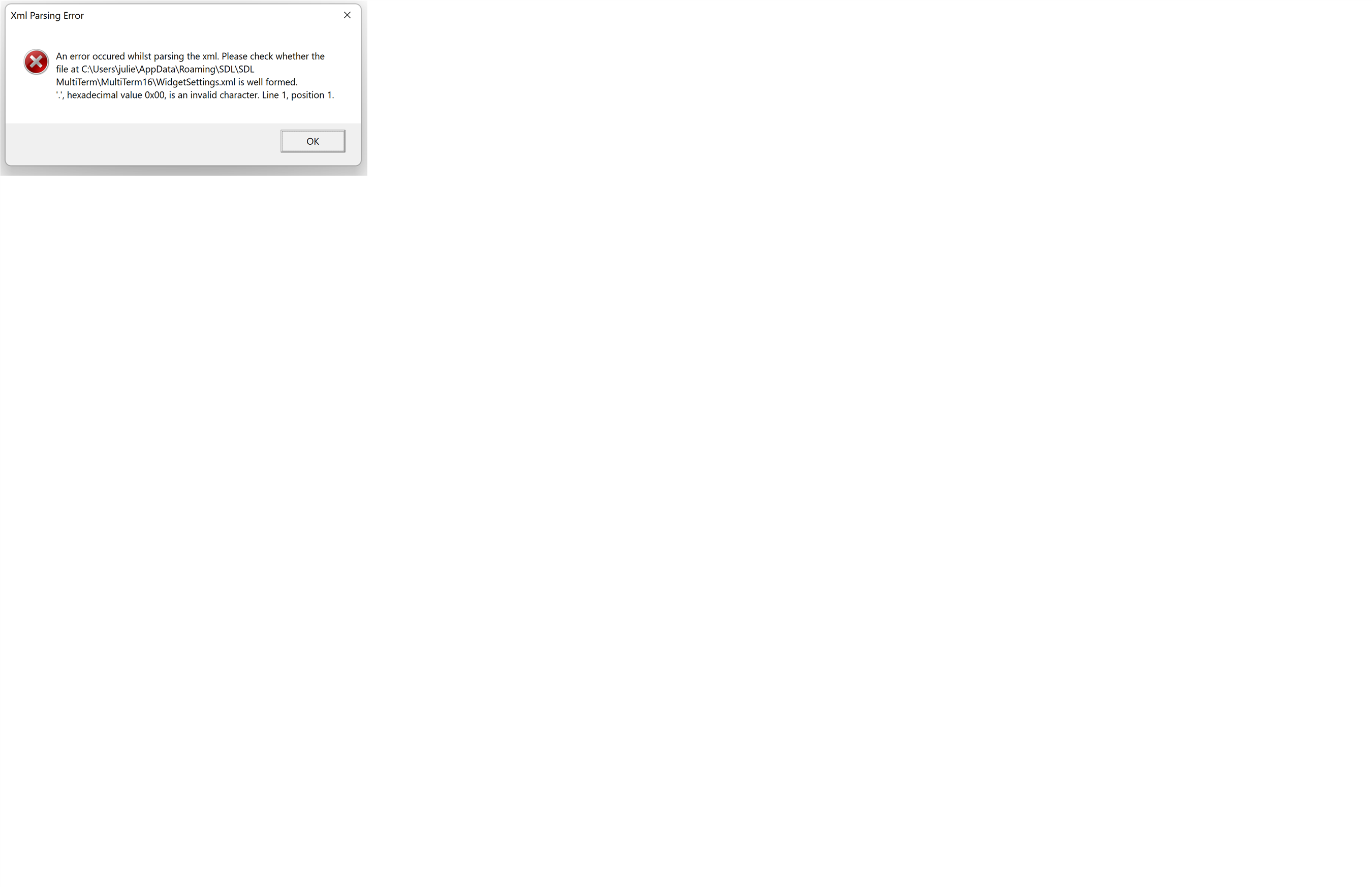 Error dialog box titled 'Xml Parsing Error' with message: An error occurred whilst parsing the xml. Please check whether the file at C:UsersjulieAppDataRoamingSDLSDL MultiTermMultiTerm15WidgetSettings.xml is well formed. '*', hexadecimal value 0x00, is an invalid character. Line 1, position 1.