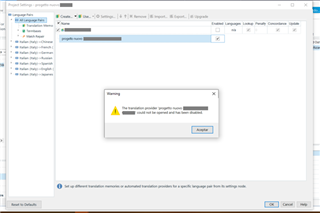 SDL Trados Studio Project Settings window with a warning pop-up: 'The translation provider project's TM name could not be opened and has been disabled.'