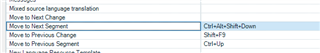 Trados Studio screenshot showing the 'Move to Next Segment' command with a shortcut set to 'Ctrl+Alt+Shift+Down'.