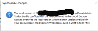 Synchronize changes pop-up in Trados Studio showing a conflict message between the local version of a file and the cloud version, asking if the user wants to overwrite with the latest cloud version.