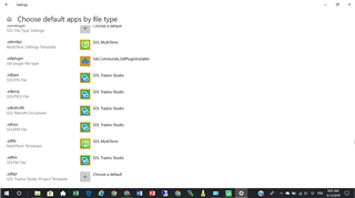 Screenshot of 'Choose default apps by file type' settings showing .sdlppx, .sdlproj, and .sdlprpx file types associated with SDL Trados Studio.