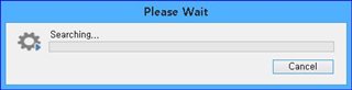 Trados Studio dialog box with the message 'Please Wait' and a progress bar indicating 'Searching...' with a cancel button.
