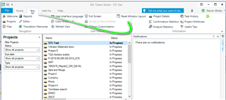 Trados Studio screenshot showing the Projects view with a list of files, some marked 'In Progress'. The menu bar highlights the 'Help' tab with an arrow pointing to 'Check for Updates'. No errors visible.