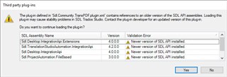 Error message in Trados Studio stating 'The plug-in defined in Sdl.CommunityTransPDF.plugin.xml contains references to an older version of the SDL API assemblies.' with options to continue loading the plug-in or not.