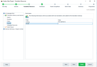Trados Studio screenshot of 'Create a New Project' wizard with 'Translation Memory and Automated Translation' step showing a field 'Auftrag' with value 'TRI-010101-18'.
