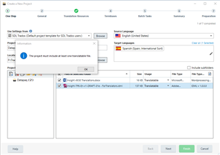 Trados Studio error message 'The project must include at least one translatable file.' with an OK button, displayed during the creation of a new project.